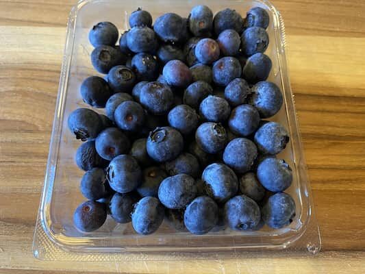 Organic blueberries in the original plastic clamshell container.
